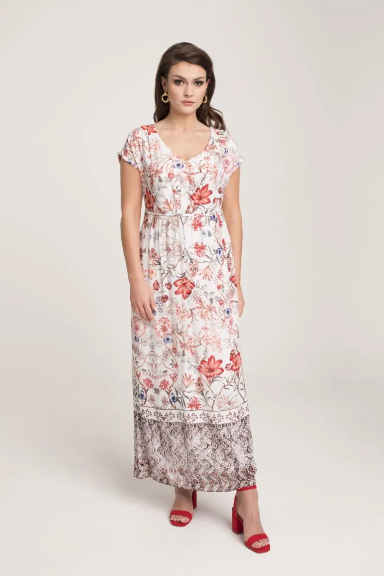 Modelka w sukience Vito Vergelis. Sukienka maksi w kolorowe kwiaty. Długa sukienka z wiskozy odcinana w talii z dekoltem V.